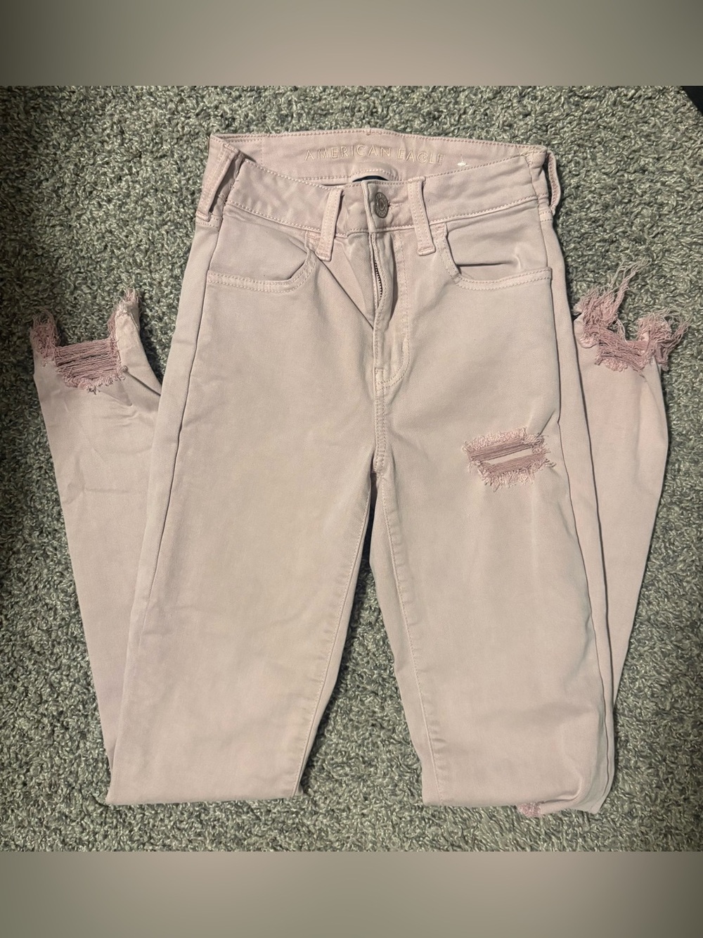 American Eagle Outfitters Pale Pink Skinny Jeans with Distressed Hem